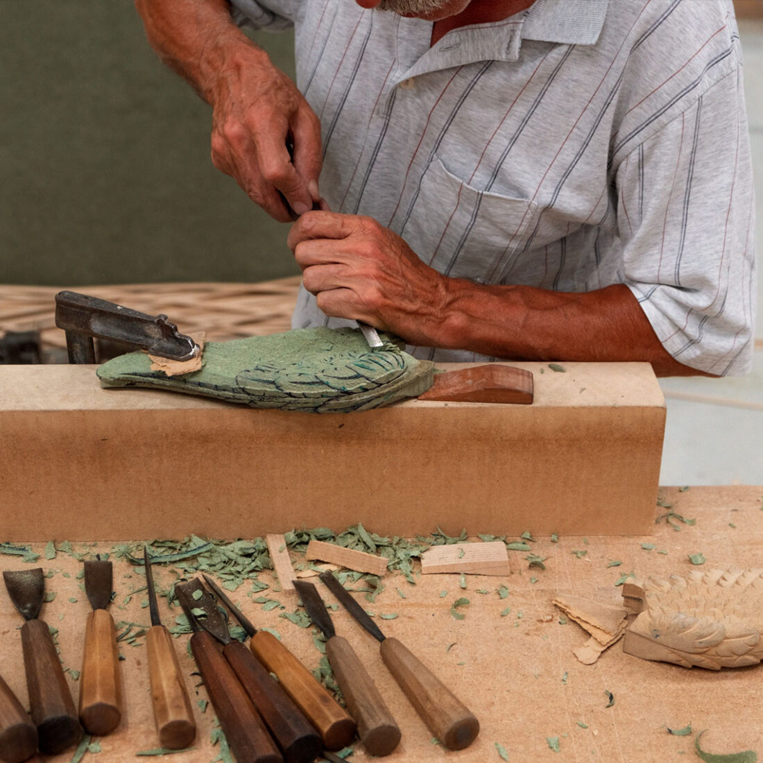 handmade stool wings by carving wood by an artisan